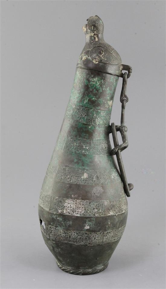 A Chinese archaic bronze flask-shaped ritual wine vessel, Hu, Eastern Zhou dynasty, 5th-4th century B.C., 36.5cm high, hole to base and